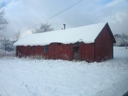 red house in the snow