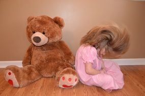 Child and big teddy bear