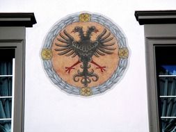 coat of arms on the facade of a building in the old town in diesenhofen