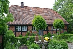Brick house in green garden, germany, barrien