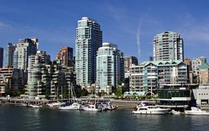 yachts at harbor in skyline of modern city, canada, british columbia, vancouver