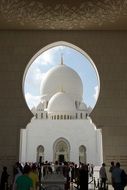 arched entrance to the mosque in abu dhabi