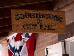 wooden shield of the courthouse at the town hall