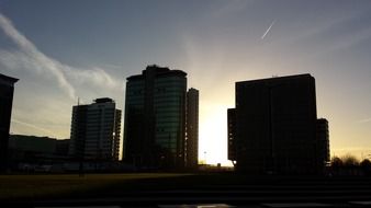 silhouettes of houses in amsterdam at dusk