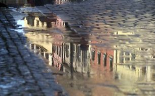 reflection of colorful townhouses