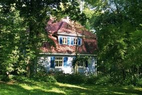 cozy house with blue shutters among the forest in Waiblingen