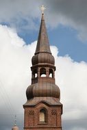 church steeple at blue sky background with white clouds in copenhagen