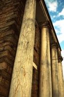 cracked plaster on columns of old building