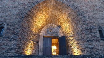 Arched entrance to a historic building in bright light in Annaberg