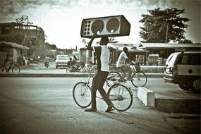people with bikes on the road