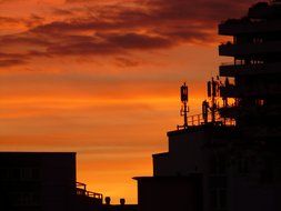 roofs of buildings at sunset