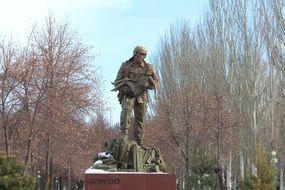 men with girl statue