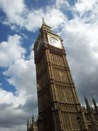 Big Ben against the sky with white clouds in London