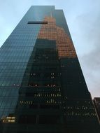 reflected in the skyscraper, Manhattan