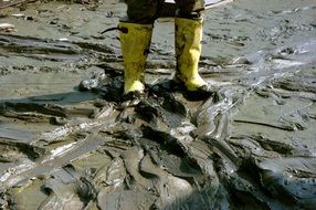 Man standing in mud