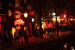 crowds of people in red lights district, netherlands, amsterdam