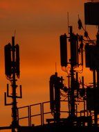 radio antennas at sunset