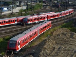 Red trains on a railway