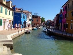 people walking on street along channel, italy, venice