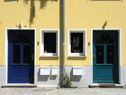 doors on the yellow building facade