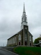 church with a spire and a bell tower