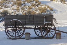 the old wooden farm equipment in the ghost town