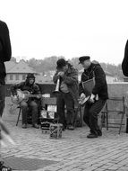 black and white image of street musicians in prague