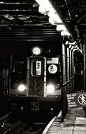 Old black and white photo of a train at a metro station