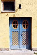 wooden entrance doors to the building