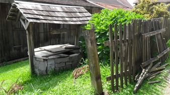 wooden fence by the well on a farm