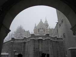 view through the arched doorway to the castle