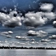 white clouds over a lake in hamburg