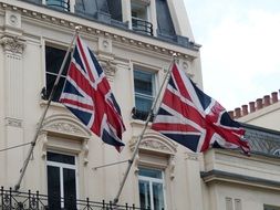 English flags on the facade of a building in London