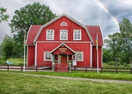 wooden building with red walls in sweden