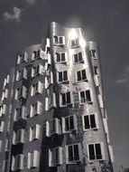 reflections of the sun in a modern skyscraper