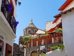 whitewashed buildings on the streets in Taxco, Mexico