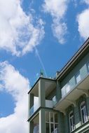 home building white clouds blue sky view