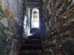 staircase at the entrance of a stone building