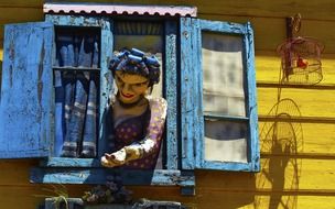sculpture of woman in the window