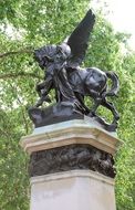 bronze statue near a mall in london