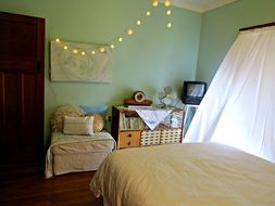 interior of bedroom with green wallpaper