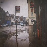 Urban street at rainy day in autumn