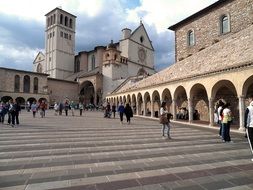 People in the square near the church in Assisi