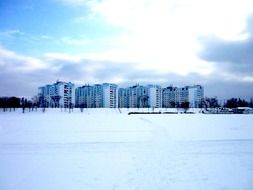 field in the snow near the houses