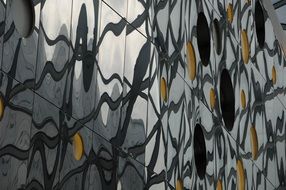 circles on the glass facade of a building in Frankfurt