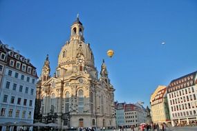 gothic medieval building at blue sky background with the colorful hot air balloon in Dresden