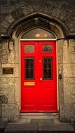 red entrance door to the building