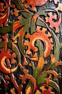 wood carving with colored paints