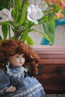 doll on a background of flowers