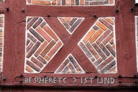 brown pattern on the facade of a farm building